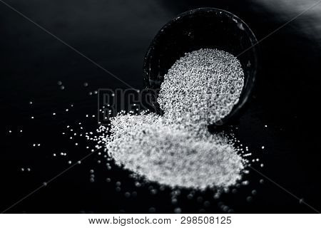 Close Up Of Clay Bowl On Wooden Surface Full Of Poppy Seeds Or Khus Or Opium Poppy Or Breadseed Popp