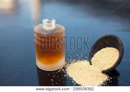 Close Up Of Clay Bowl On Wooden Surface Full Of Poppy Seeds Or Khus Or Opium Poppy Or Breadseed Popp