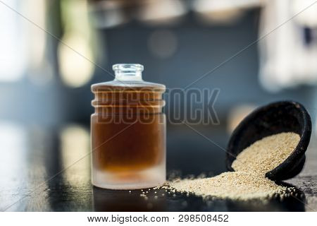 Close Up Of Clay Bowl On Wooden Surface Full Of Poppy Seeds Or Khus Or Opium Poppy Or Breadseed Popp