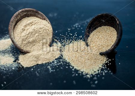 Close Up Of Clay Bowl On Wooden Surface Full Of Poppy Seeds Or Khus Or Opium Poppy Or Breadseed Popp