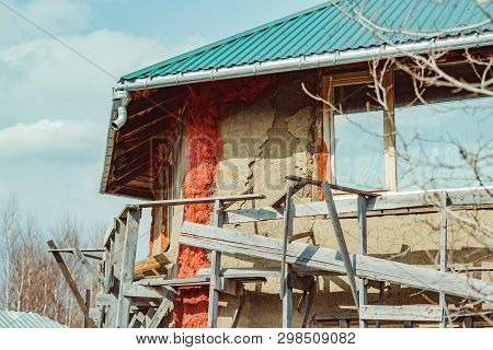 Unfinished House Of Straw Blocks Covered With Clay