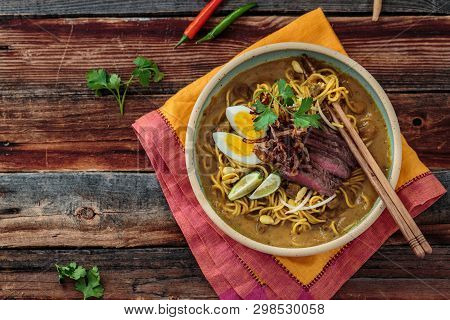 Malaysia Spicy Noodle Mee Rebus With Beef Egg And Fried Onion, Copy Space