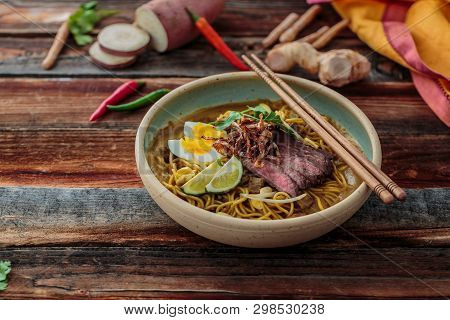 Malaysia Spicy Noodle Mee Rebus With Beef Egg And Fried Onion, Copy Space