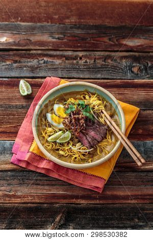 Malay Mee Rebus With Beef, Eg And Onion In A Bowl, Copy Space