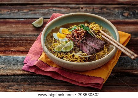 Malaysia Spicy Noodle Mee Rebus With Beef Egg And Fried Onion, Copy Space