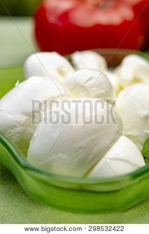 Twisted To Form A Plait Treccia Mozzarella Italian Soft Cheese Served With Fresh Basil And Tomatoes