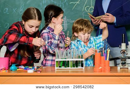 Chemistry Lab. Back To School. Happy Children Teacher. Kids In Lab Coat Learning Chemistry In School