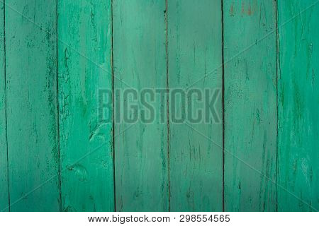 Background Of Green Flaky Wood
Backdrop Of Green Colored Wooden Panels With Aged Flaky Surface