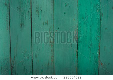 Background Of Green Flaky Wood
Backdrop Of Green Colored Wooden Panels With Aged Flaky Surface
