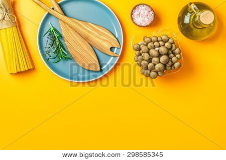 Spaghetti, Shimeji Mushroom, Olive Oil,  Pink Salt, Empty Ceramic Bowl, Wooden Spoons For Salad Over