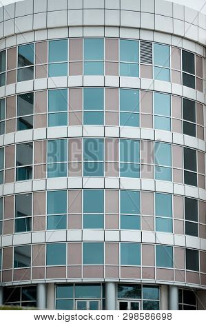Glass Facade Of A Modern Multi-storey Building, Skyscraper. A Large Number Of Residential And Commer