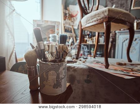 Artists Workshop With Necessary Eguipment  Like Paint, Brushes, Frames, , Table  Chair