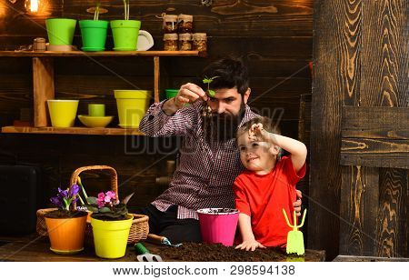 Father And Son. Family Day. Greenhouse. Bearded Man And Little Boy Child Love Nature. Happy Gardener