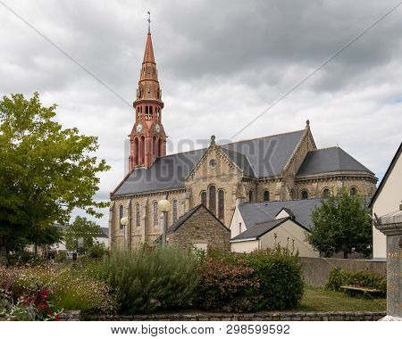 The Church In Saint-lyphard (france) On A Cloudy Day In Summer