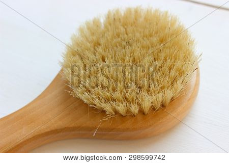 Close-up Of Wooden Massage Brush Isolated On White Background. Brush For Dry Massage. Anti-cellulite