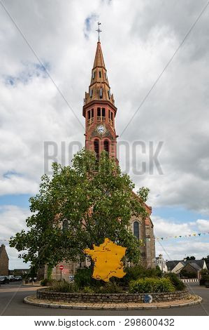The Church In Saint-lyphard (france) On A Cloudy Day In Summer