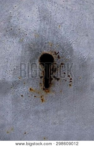 Detail Of An Old Lock On A Wooden Door. Old Lock On A Weathered Wooden Door. Keyhole In An Old Panel