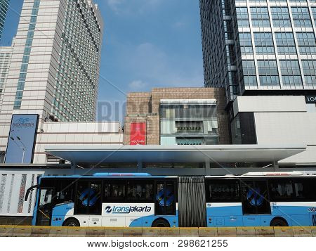 Jakarta, Indonesia - April 17, 2019: Transjakarta Bus Getting Some Passengers At Bundaran Hi Bus She