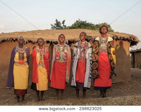 Wide Shot Of A Group Of Maasai Women Singing