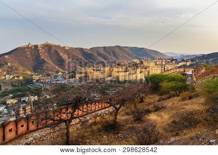 View Of Amber Fort And Palace In Maotha Lake From Mountain. Jaipur. Rajasthan. India