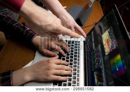 Friendly Team Making Movie Using A Laptop, Videoediting Process