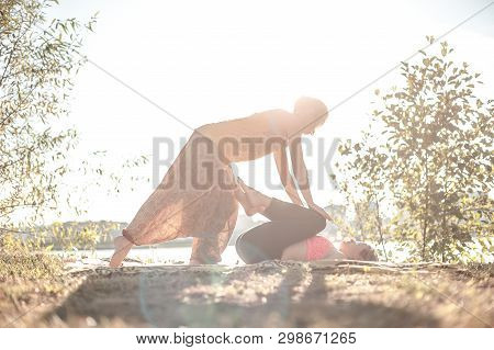 Proffesional Masseuse Provides A Thorough Massage  On The Forest Floor.