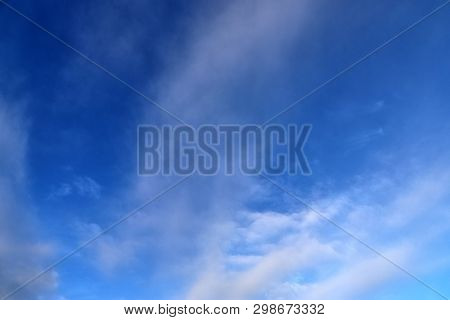 Beautiful Mixed Cloud Formations With White And Grey Cumulus Clouds In The Sunlight On A Blue Sky Se