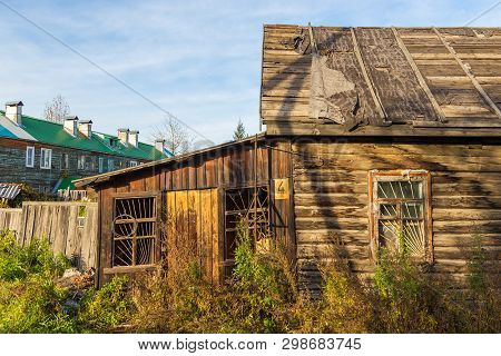 Milkovo, Kamchatka, Russia- 27 September 2014: View Of The Old Wooden, Abandoned Hose In Milkovo. To
