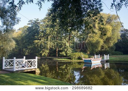 Frederiksberg, Denmark - September 8, 2016: A Wooden Boat And Two Jetties In Frederiksberg Gardens.