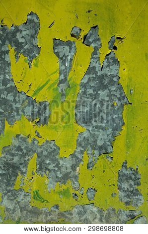 Close-up Of Metal Plate Covered By Cracks And Peeling Paint, Forming A Singular Background At Unhais