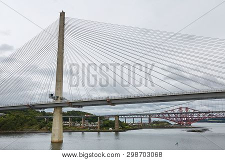 The New Queensferry Crossing Bridge Over The Firth Of Forth With The Older Forth Road Bridge And The