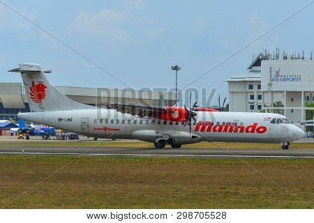 Airplane Taxiing On Runway
