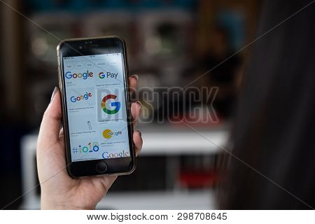 Chiangmai, Thailand - May 01,2019 : Close Up On Man Hand Hold Iphone And Searching On Www.google.com