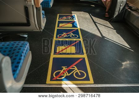 View Inside The Modern Train To The Corridor With Signs Prohibiting Putting Luggage And Bicycles In 