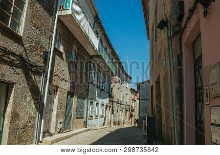 Guarda, Portugal - July 16, 2018. Old Houses And Narrow Deserted Alley On Slope, In A Sunny Day At G