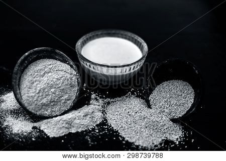 Clay Bowl On Wooden Surface Full Of Poppy Seeds Or Khus Or Opium Poppy Or Bread Seed Poppy With Its 