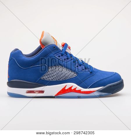 Vienna, Austria - August 23, 2017: Nike Air Jordan 5 Retro Low Knicks Blue And Red Sneaker On White 