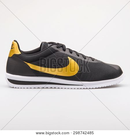 Vienna, Austria - August 23, 2017: Nike Cortez Ultra Qs Black And Gold Sneaker On White Background.