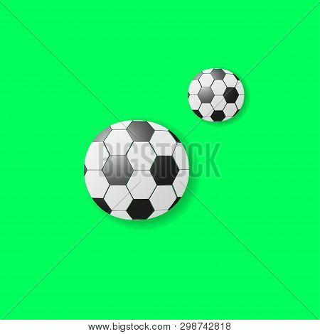 Two Footballs At Different Distances Are On A Green Background