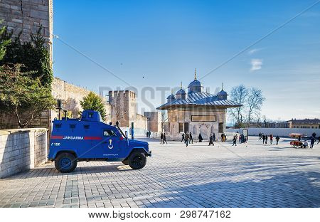 The Blue Armored Car Of The Turkish Gendarmerie Stands At The Gate To The Topkapi Palace, Next To Th