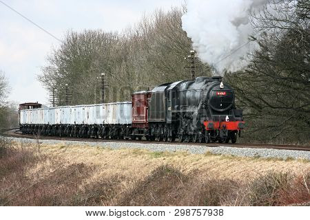 Black Five Steam Loco Number 44767 With Windcutter Freight Train At The Great Central Railway Herita