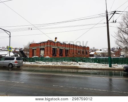 Repair And Construction - Brick House Under Construction And A Crane Nearby
