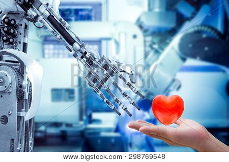 Concept Image Of Human Heart On Hand Send To A Robot For Make The Robots Have Feelings, Love, Like A