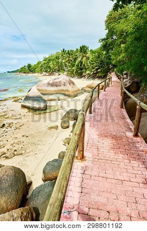 Walkway On Coastline Of Anse Cimitiere, Tropical Beach, Praslin,