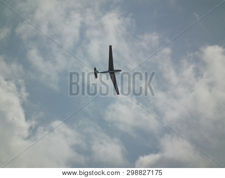 Glider In Free Flight. Demonstration Flights Of Aircraft During The Aviation Festival