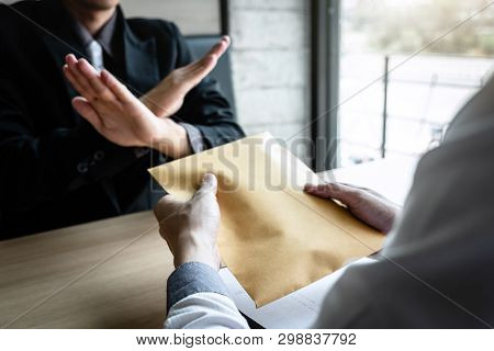 Anti Bribery And Corruption Concept, Business Man Refusing And Don't Receive Money Banknote In Envel