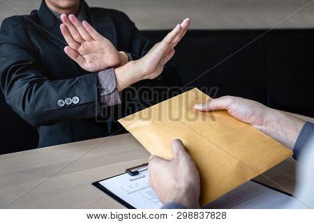 Anti Bribery And Corruption Concept, Business Man Refusing And Don't Receive Money Banknote In Envel