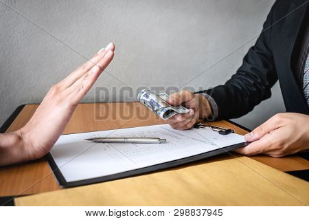 Anti Bribery And Corruption Concept, Business Man Refusing And Don't Receive Money Banknote In Envel