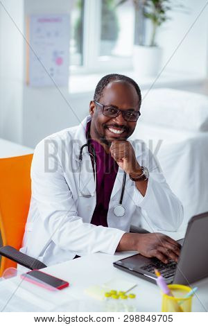 Cheerful Doctor Smiling Broadly After Making Scientific Invention