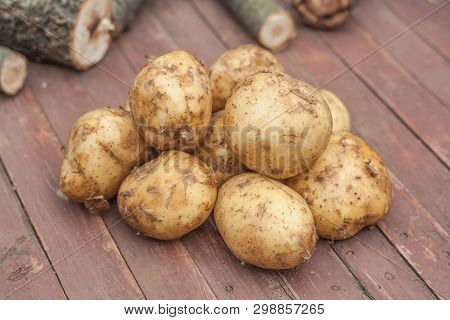 Many Fresh Potatoes In A Wooden Basket